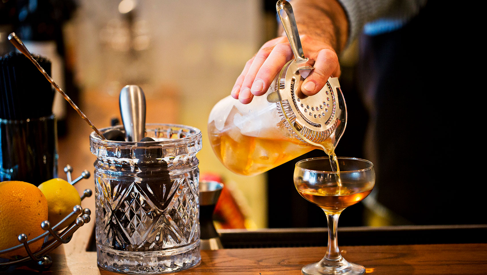 Bartender pouring a cocktail