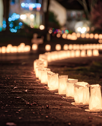 Walk way lined with lit paper lanterns